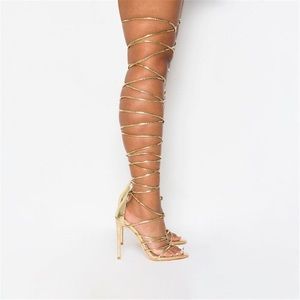 Strappy gold thigh high heels
